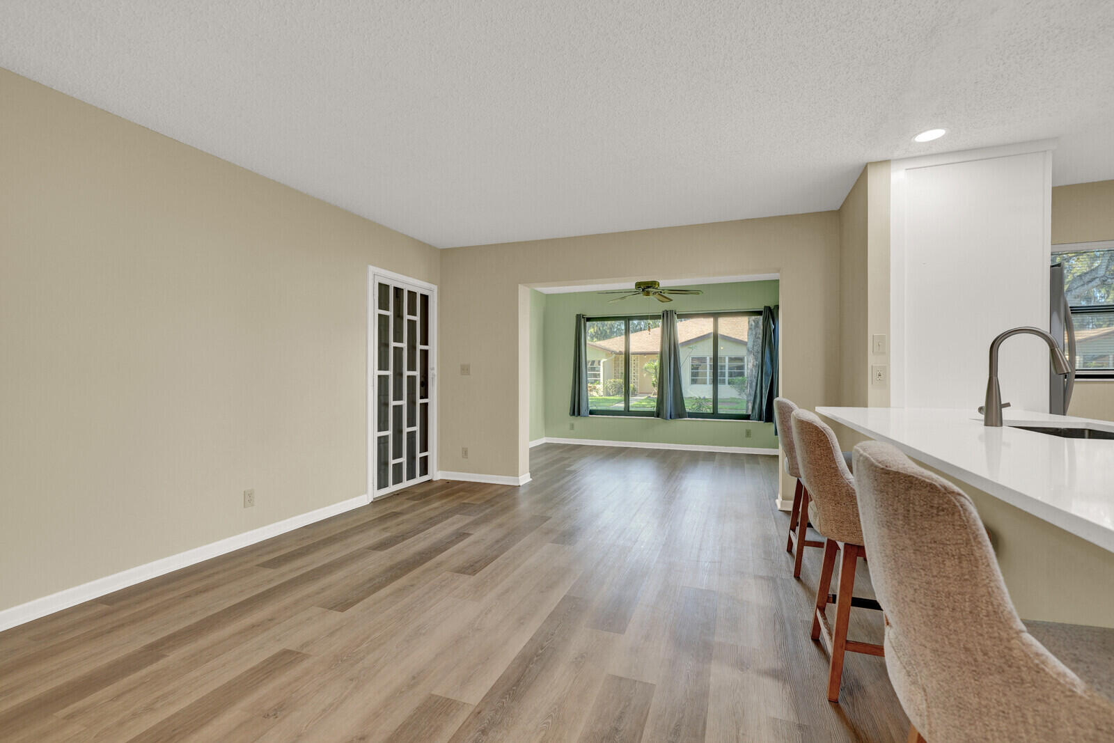 5270 Nesting Way, Unit C Delray Beach, FL 33484 - Photo 16 of 38 a view of a livingroom with wooden floor and furniture