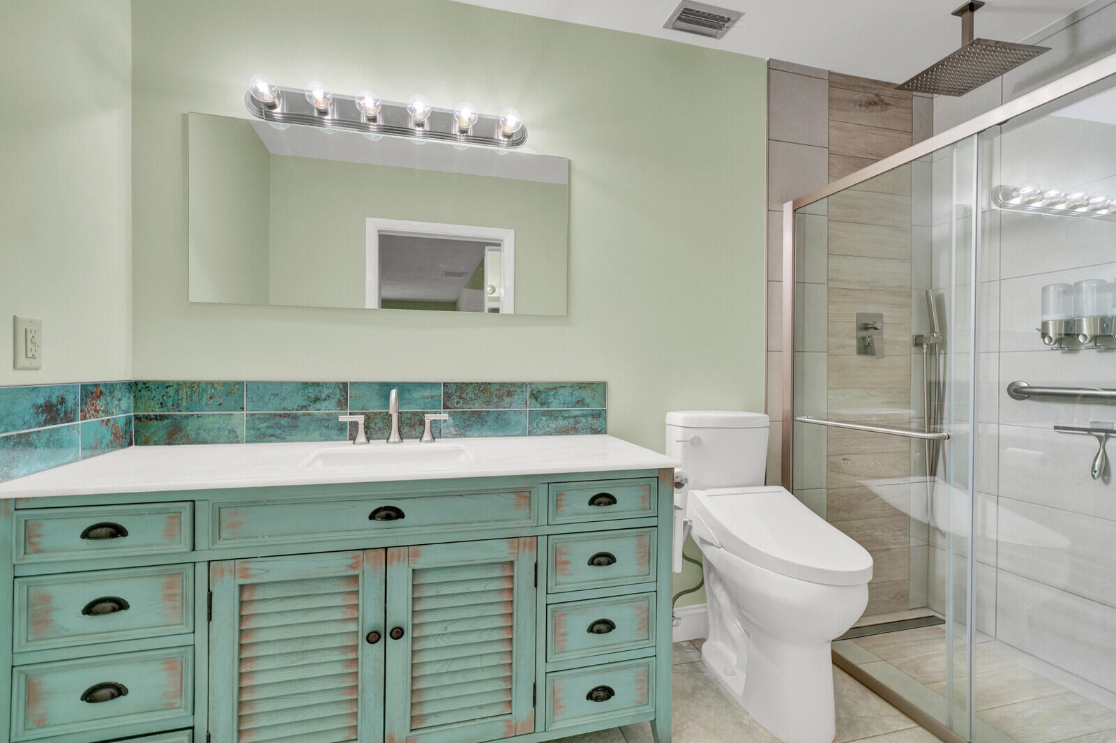 5270 Nesting Way, Unit C Delray Beach, FL 33484 - Photo 24 of 38 a bathroom with a sink a toilet and shower