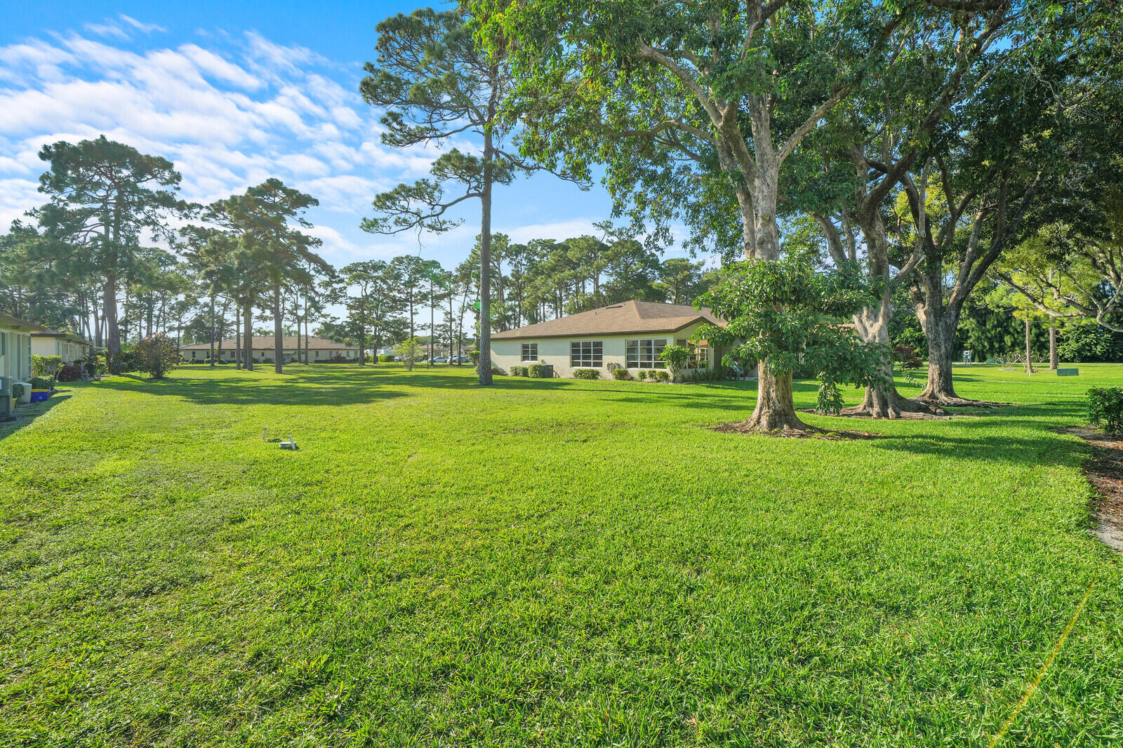 5270 Nesting Way, Unit C Delray Beach, FL 33484 - Photo 28 of 38 a view of a park with large trees