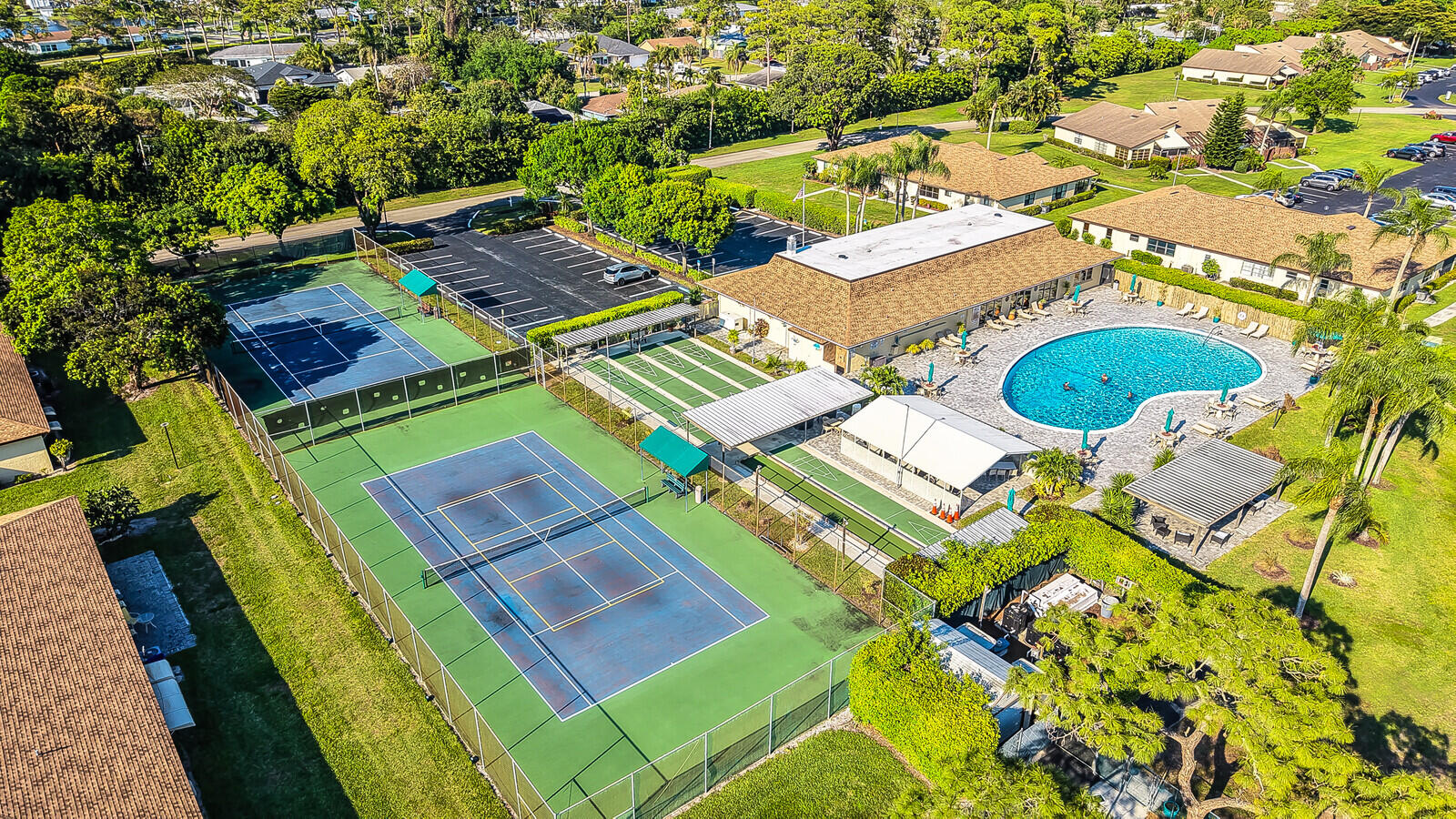 5270 Nesting Way, Unit C Delray Beach, FL 33484 - Photo 34 of 38 an aerial view of a house with a swimming pool
