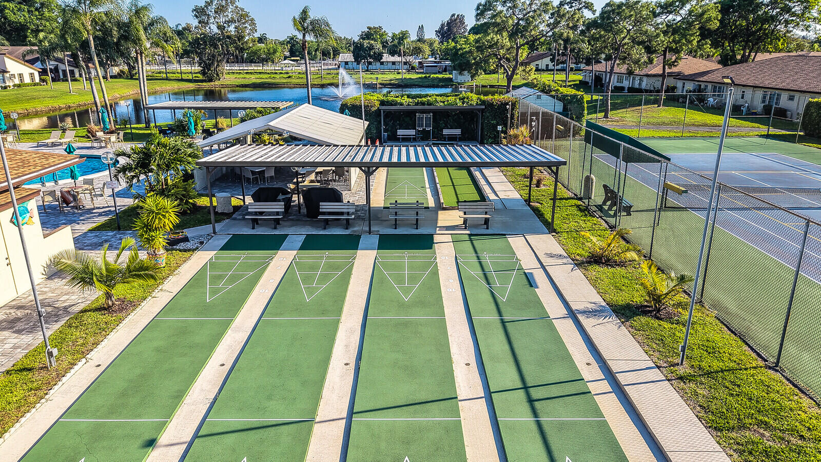 5270 Nesting Way, Unit C Delray Beach, FL 33484 - Photo 37 of 38 a view of swimming pool with sitting area