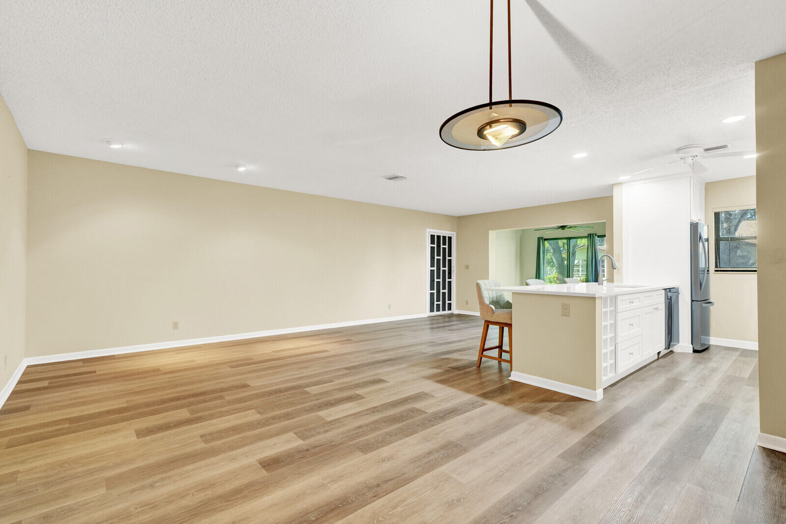 5270 Nesting Way, Unit C Delray Beach, FL 33484 - Photo 5 of 38 a view of a room with wooden floor and a window