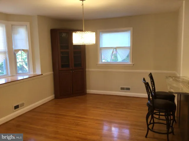 a view of a dining room with furniture and window