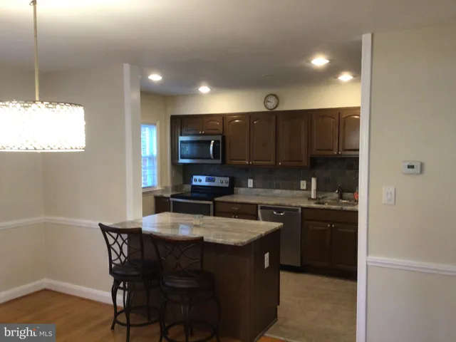 a kitchen with a sink cabinets and window