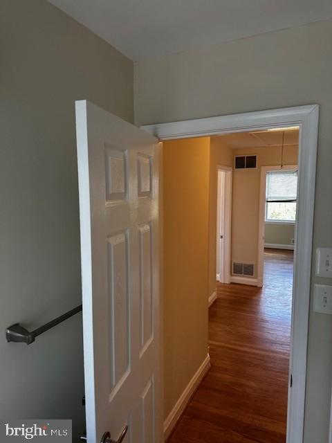1613 Winford Road Baltimore, MD 21239 - Photo 23 of 42 a view of a hallway with wooden floor