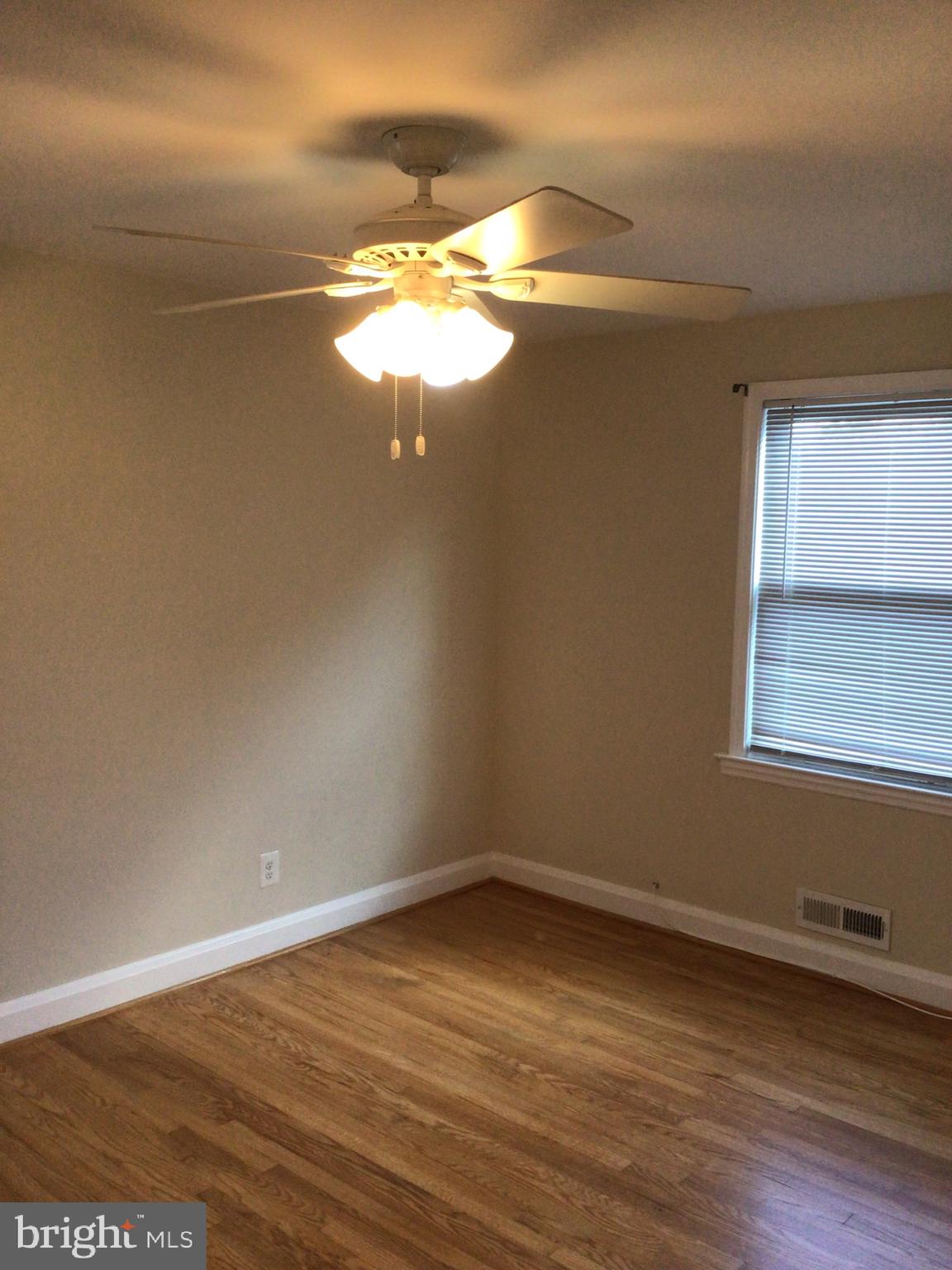 1613 Winford Road Baltimore, MD 21239 - Photo 33 of 42 a view of a room with wooden floor and window