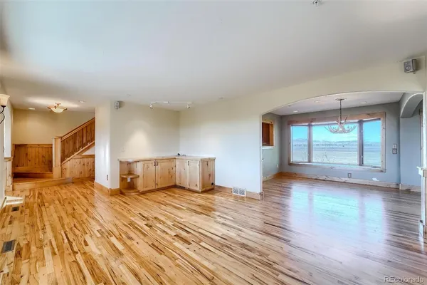 a view of a livingroom with wooden floor