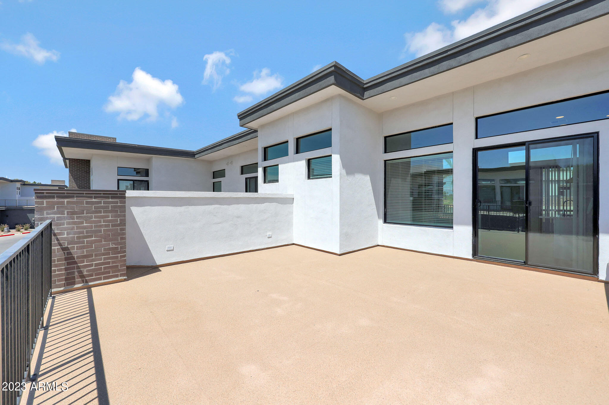 6060 East Baseline Road, Unit 175 Mesa, AZ 85206 - Photo 3 of 45 a view of a house with a patio