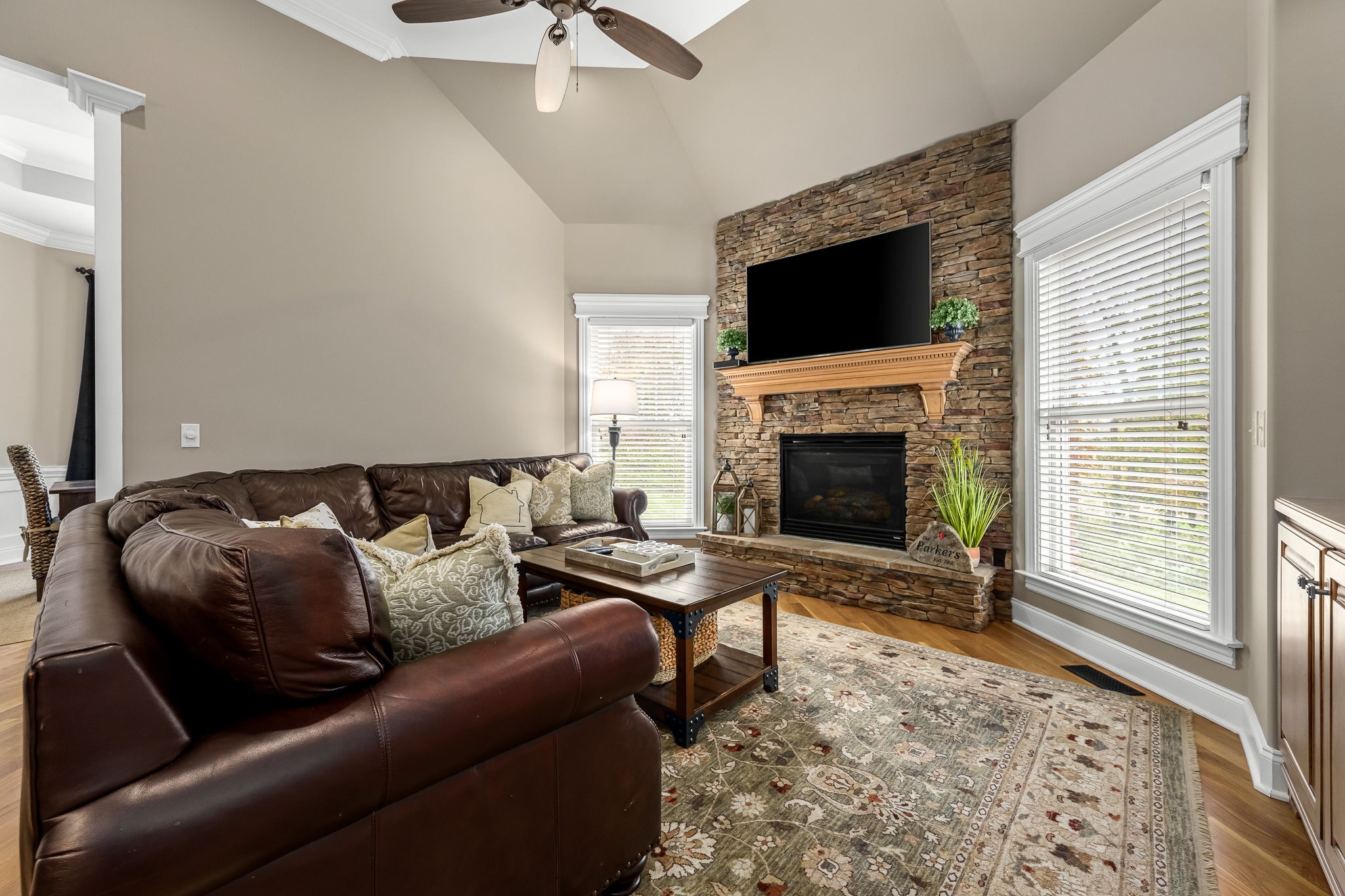 264 Cascade Drive Winchester, TN 37398 - Photo 34 of 86 a living room with furniture a flat screen tv and a fireplace