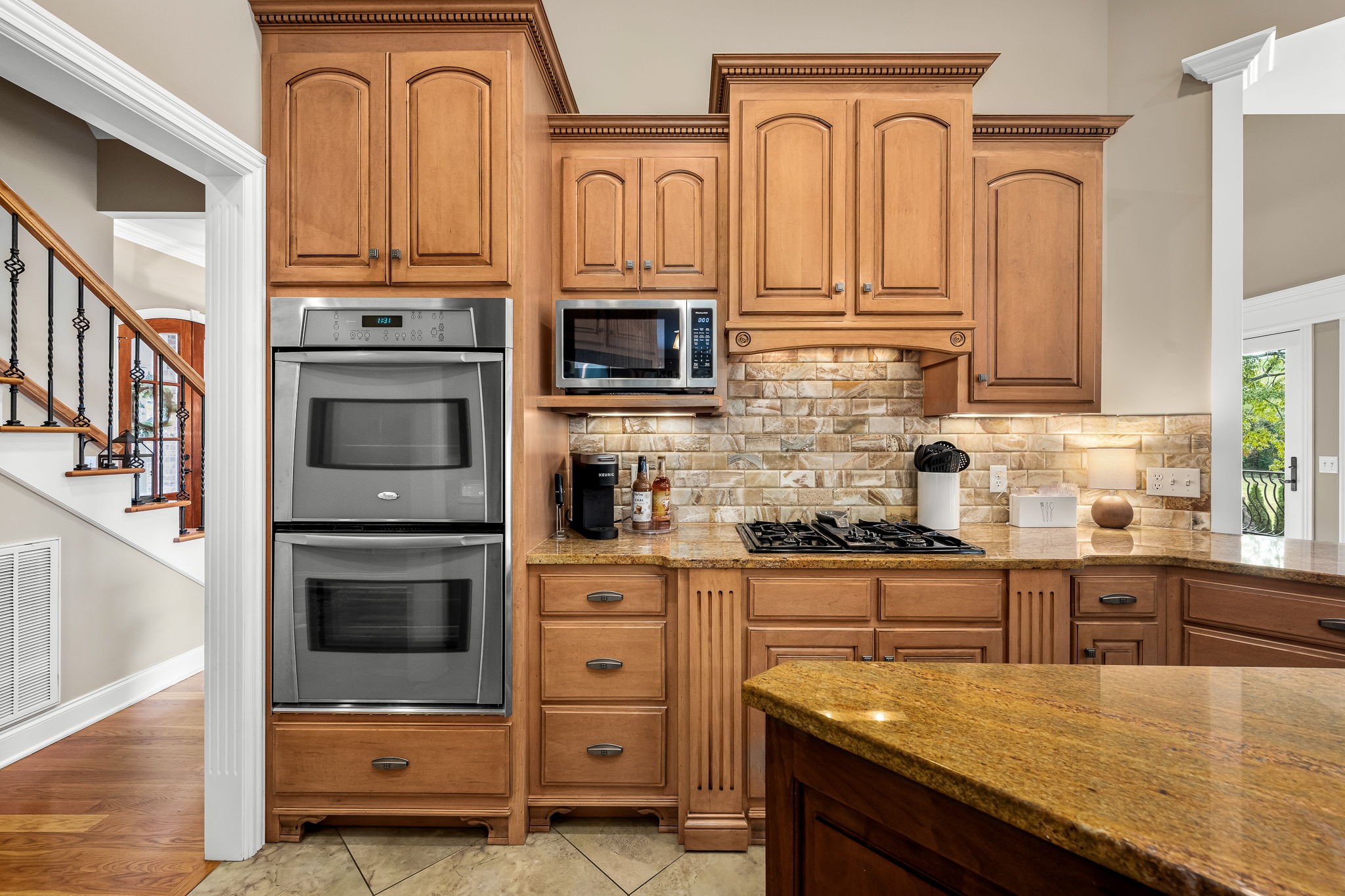264 Cascade Drive Winchester, TN 37398 - Photo 44 of 86 a kitchen with stainless steel appliances granite countertop a stove microwave and cabinets
