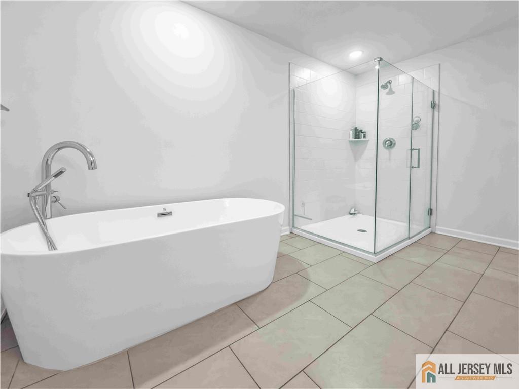 204 Honeysuckle Lane Warren, NJ 07059 - Photo 11 of 17 a bathroom with a bathtub and shower