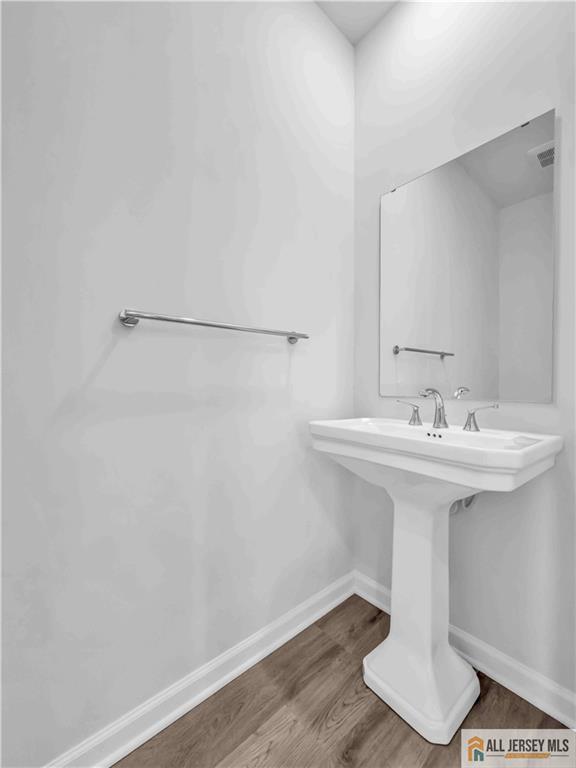 204 Honeysuckle Lane Warren, NJ 07059 - Photo 15 of 17 a bathroom with a sink and mirror