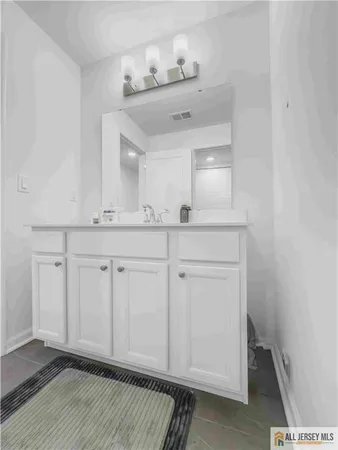 a view of cabinets and wooden floor