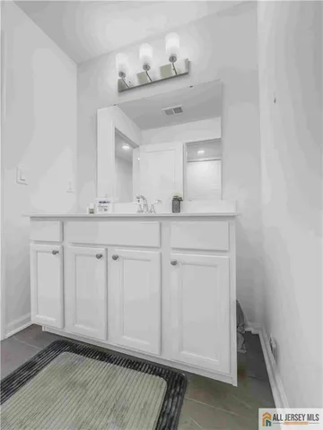 a view of cabinets and wooden floor