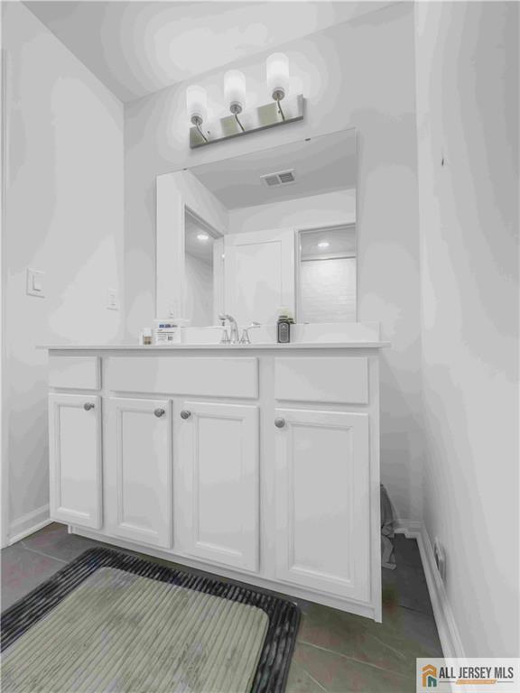 204 Honeysuckle Lane Warren, NJ 07059 - Photo 17 of 17 a view of cabinets and wooden floor