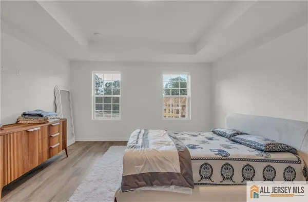 a bedroom with a stove and a window