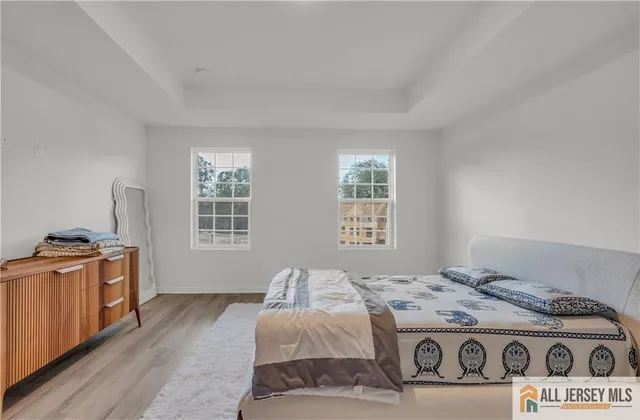 a bedroom with a stove and a window