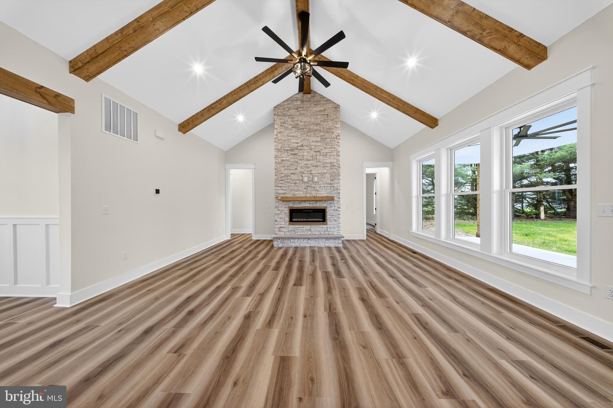 14133 Pepperbox Road Delmar, DE 19940 - Photo 11 of 59 wooden floor in an empty room with a fireplace