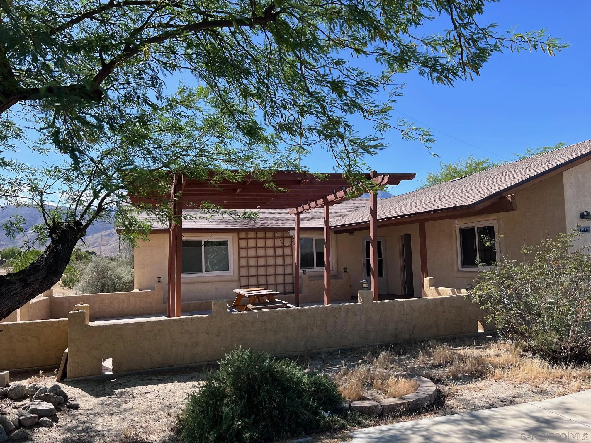 a view of house with yard