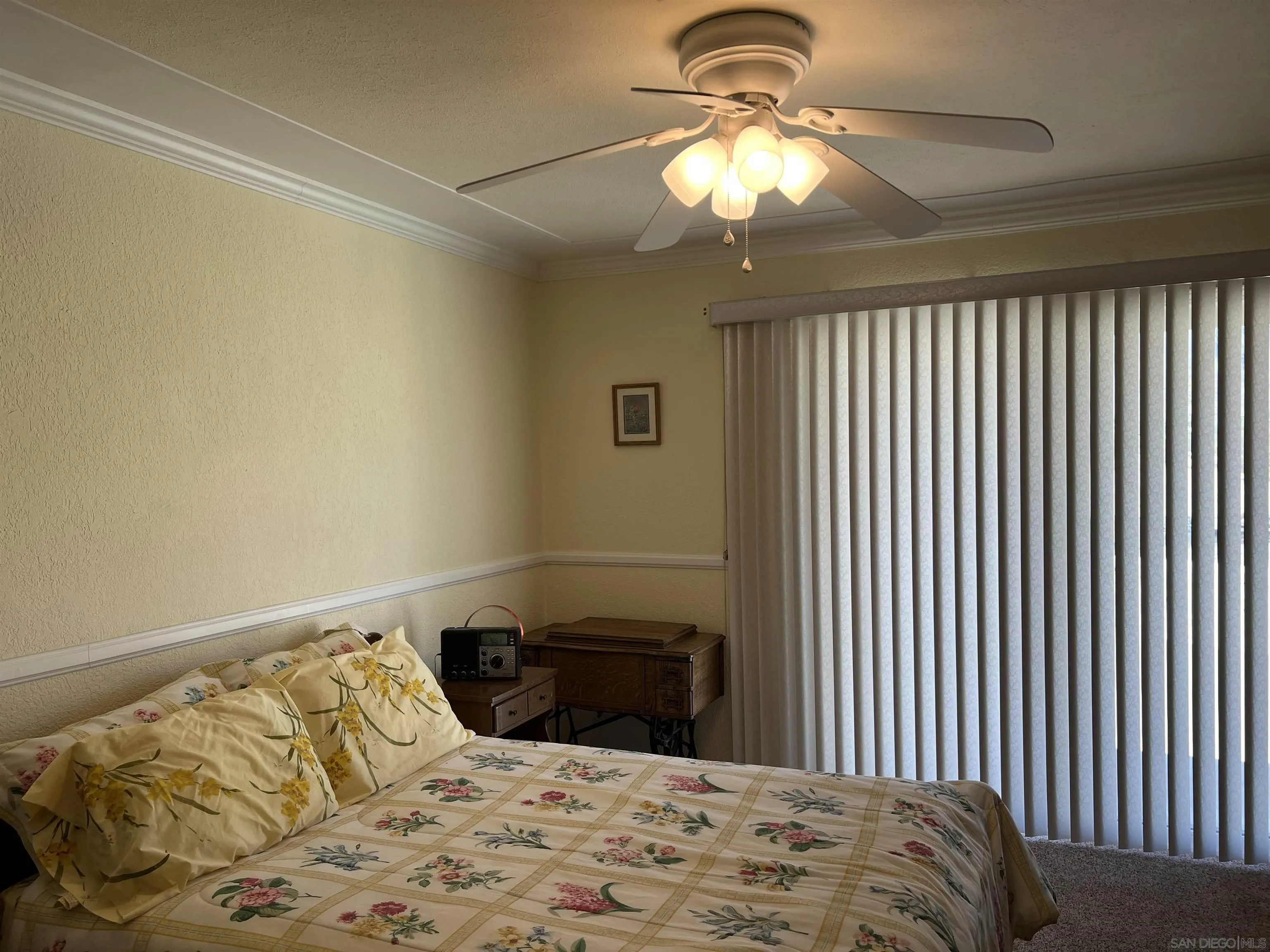 2960 Frying Pan Road Borrego Springs, CA 92004 - Photo 22 of 28 a bedroom with a bed and a chandelier