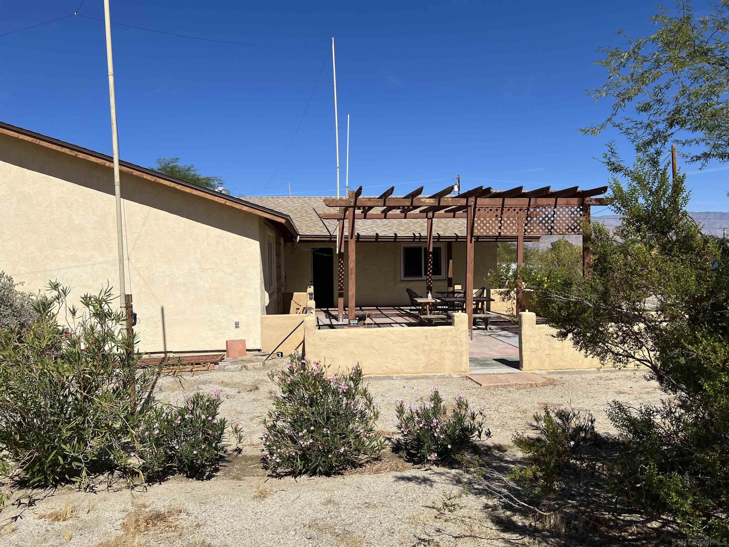 2960 Frying Pan Road Borrego Springs, CA 92004 - Photo 3 of 28 a view of a house with a yard covered with snow