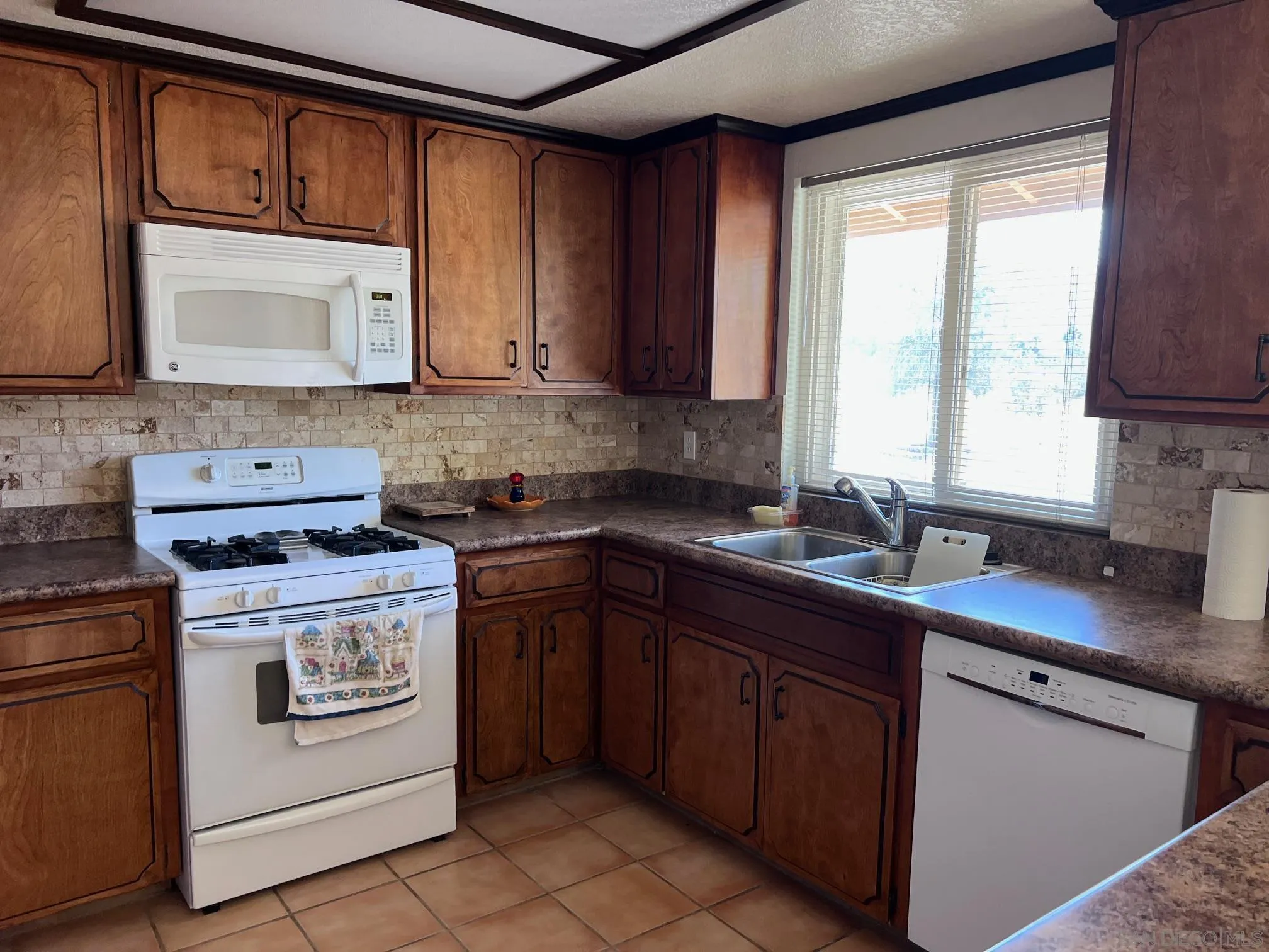 2960 Frying Pan Road Borrego Springs, CA 92004 - Photo 5 of 28 a kitchen with a sink stove top oven and cabinets