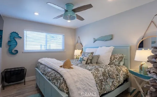 a bedroom with a large bed and a window