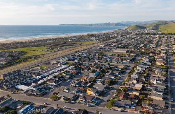 a view of a patio with table and chairs