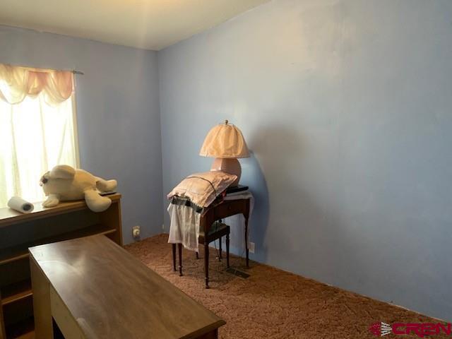 19922 Jay Road Austin, CO 81410 - Photo 8 of 14 a living room with furniture and a window