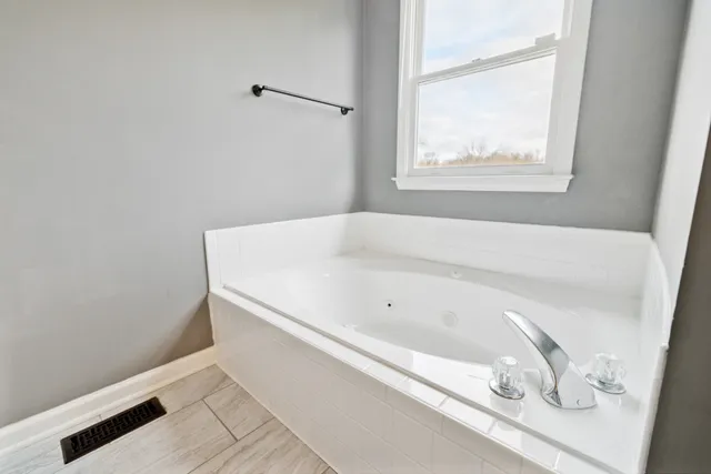 a view of an empty room and window