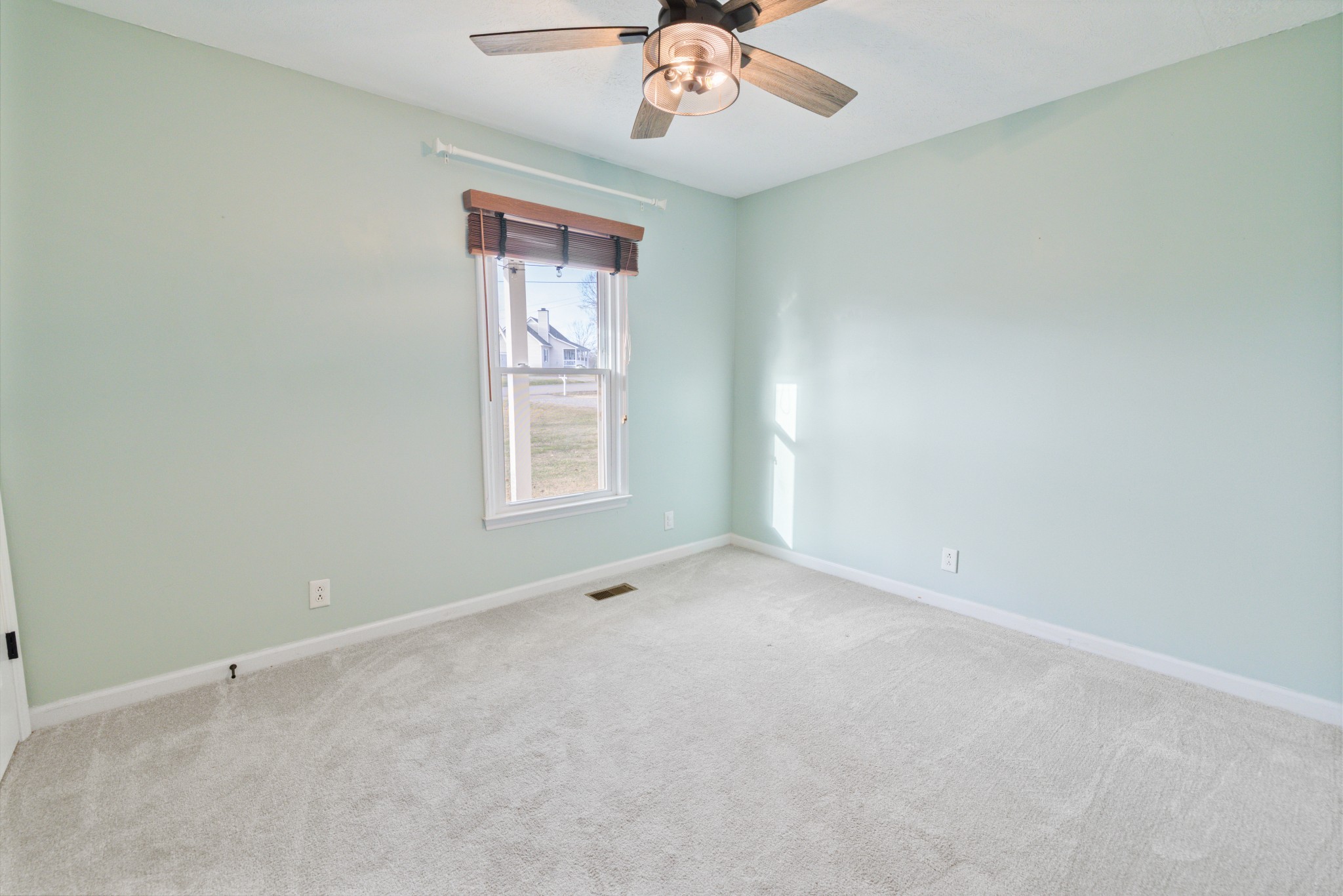 109 Lafayette Rockvale, TN 37153 - Photo 23 of 43 an empty room with a window and a chandelier fan