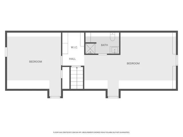 a view of a hallway with staircase