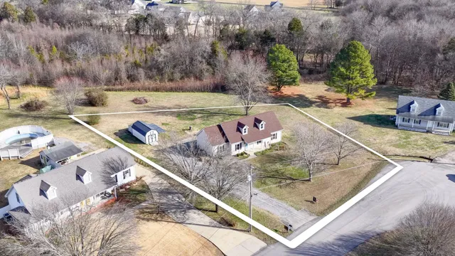 an aerial view of residential building and lake
