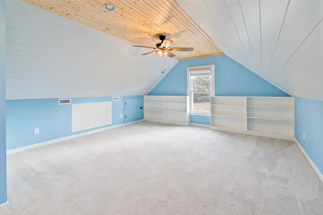 a view of a big room with carpet