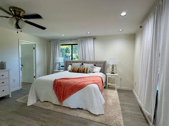 a bedroom with a bed and a dresser