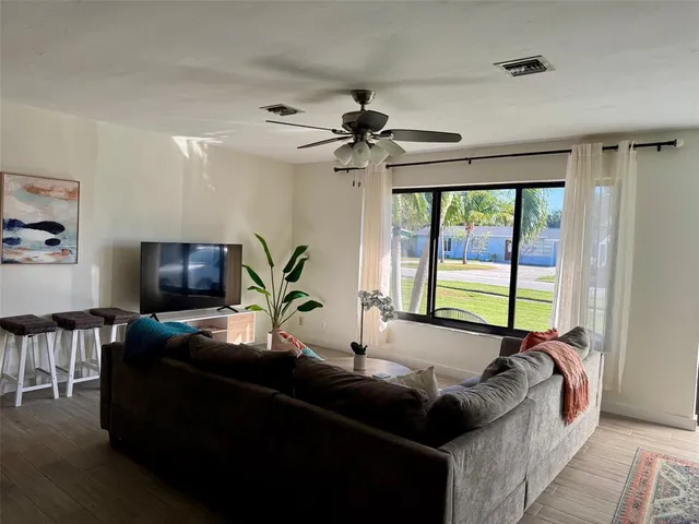 a bed room with a bed and a chandelier