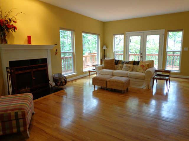 4651 Heath Road Nashville, TN 37221 - Photo 2 of 20 Great room with cozy wood burning fireplace and walls of windows letting nature inside!!