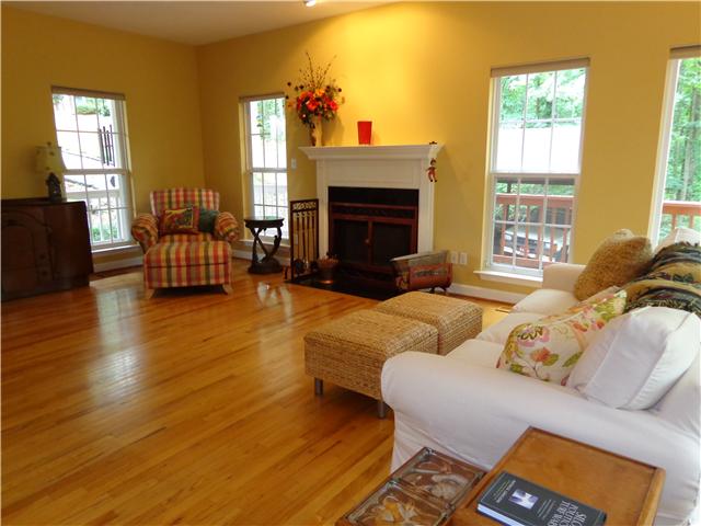 4651 Heath Road Nashville, TN 37221 - Photo 3 of 20 Great room with cozy wood burning fireplace and hardwood floors.