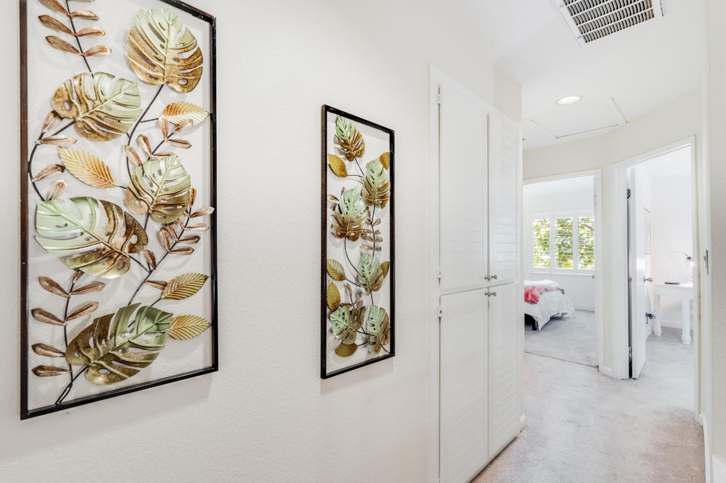 6936 Gregorich Drive, Unit E San Jose, CA 95138 - Photo 15 of 44 a hallway with painting and a window
