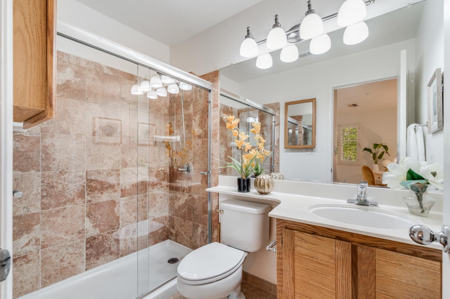 6936 Gregorich Drive, Unit E San Jose, CA 95138 - Photo 18 of 44 a bathroom with a sink vanity granite and toilet