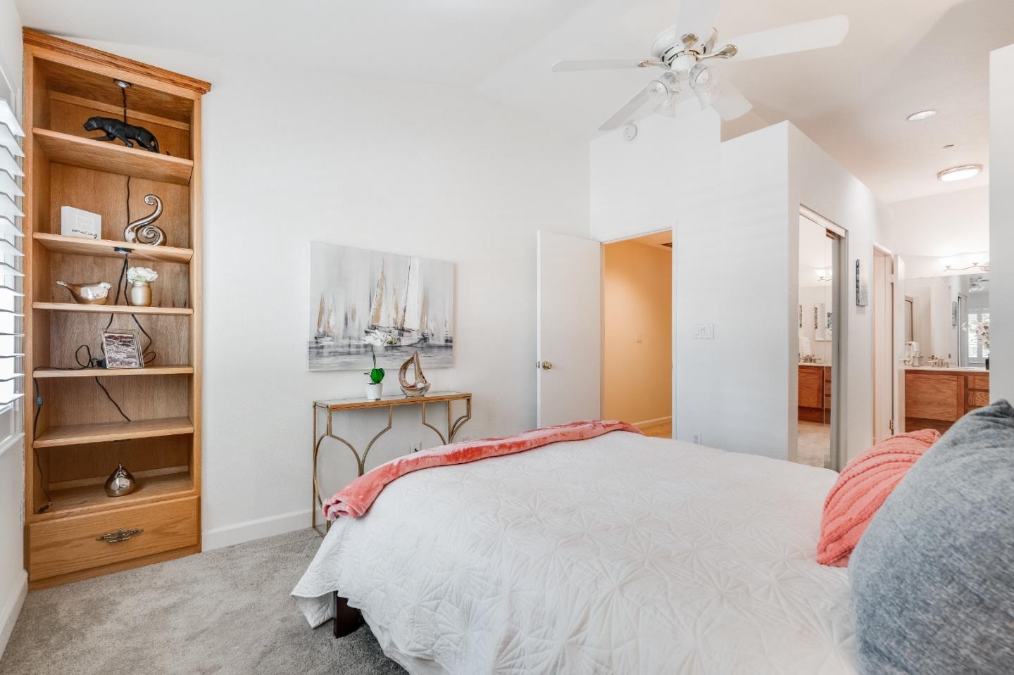 6936 Gregorich Drive, Unit E San Jose, CA 95138 - Photo 20 of 44 a bedroom with a bed and a cabinets