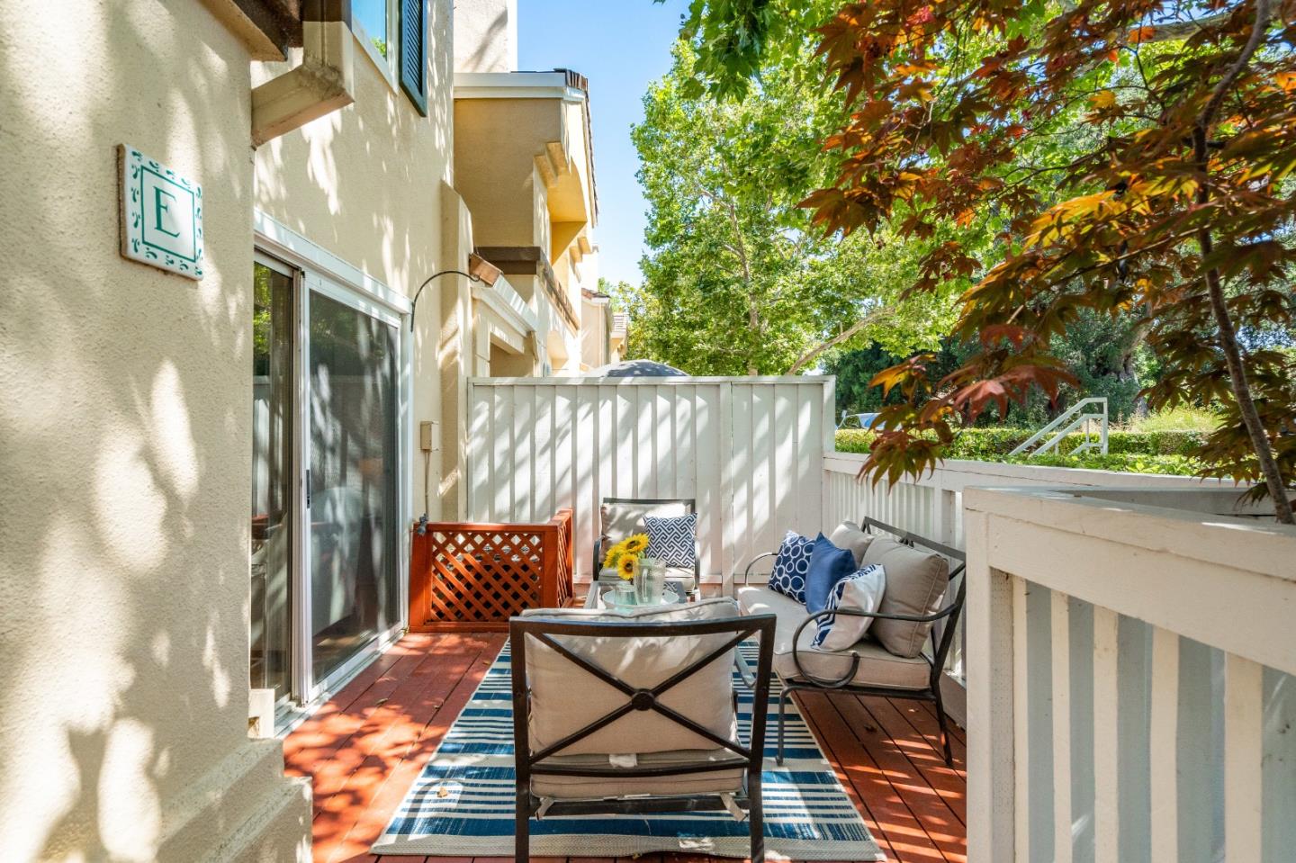 6936 Gregorich Drive, Unit E San Jose, CA 95138 - Photo 24 of 44 a backyard of a house with table and chairs