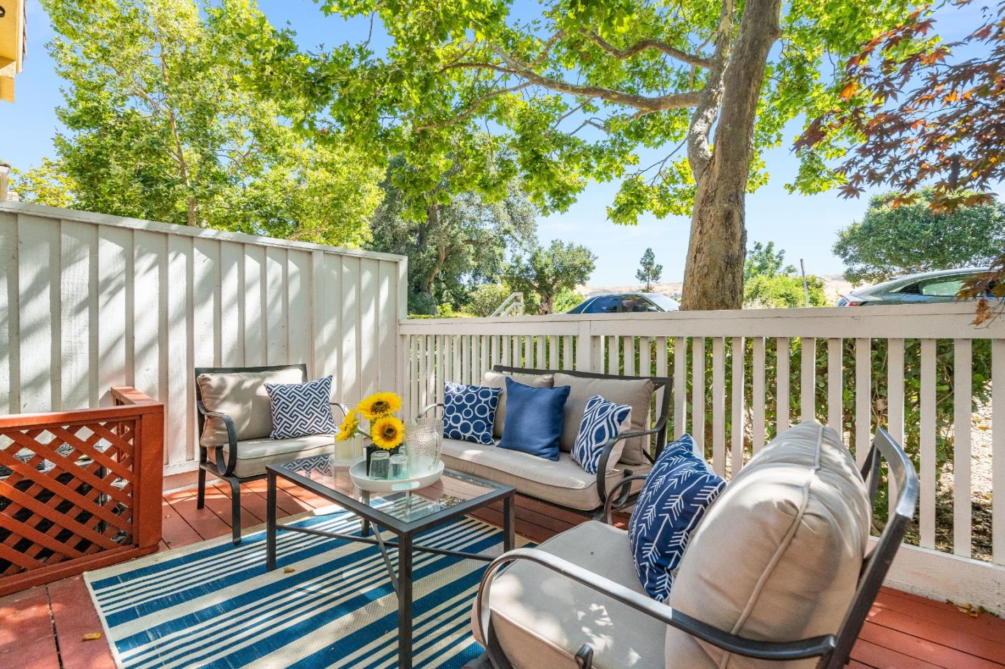 6936 Gregorich Drive, Unit E San Jose, CA 95138 - Photo 25 of 44 a roof deck with couches and wooden fence