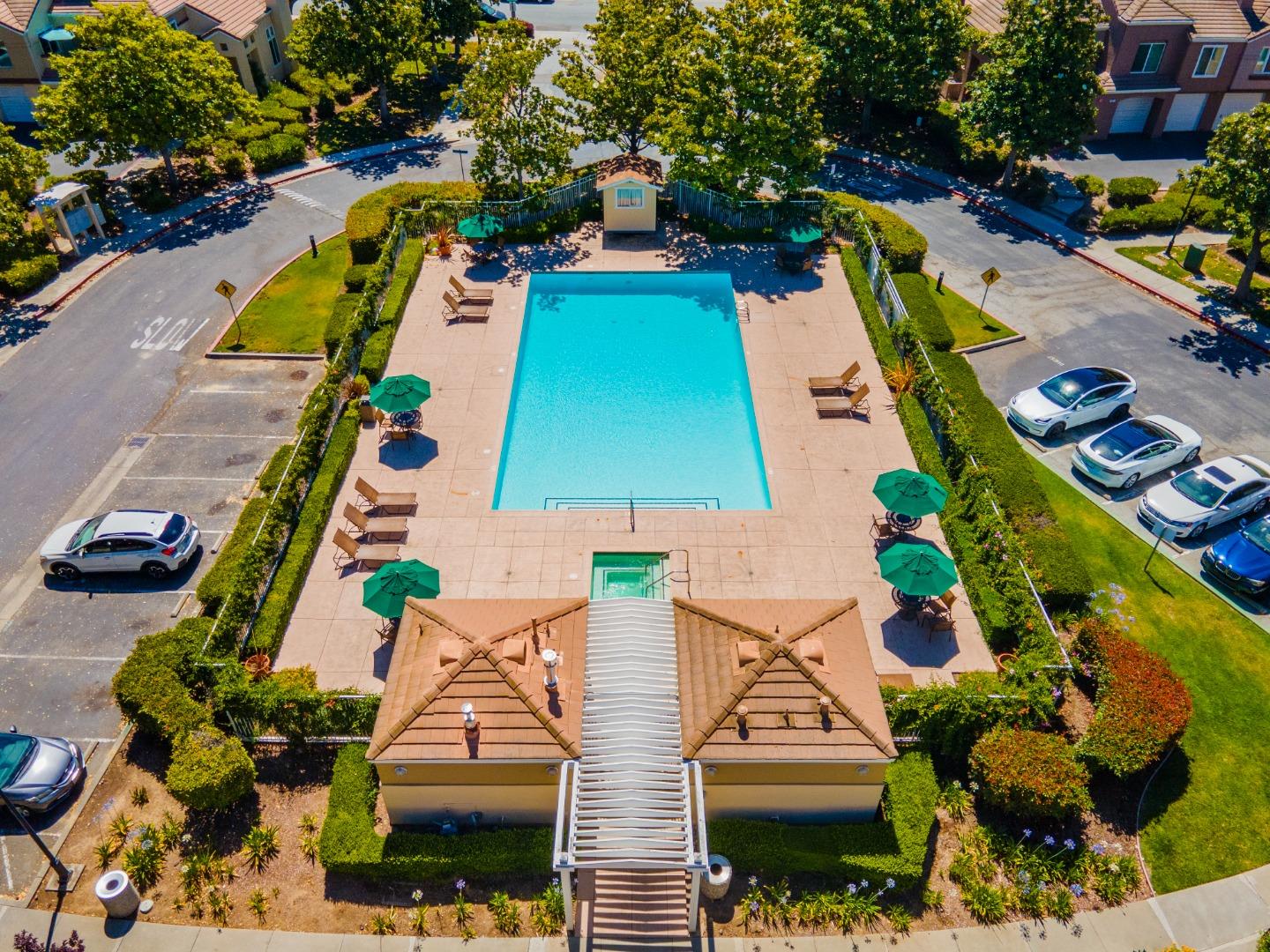 6936 Gregorich Drive, Unit E San Jose, CA 95138 - Photo 30 of 44 an aerial view of swimming pool patio and outdoor seating