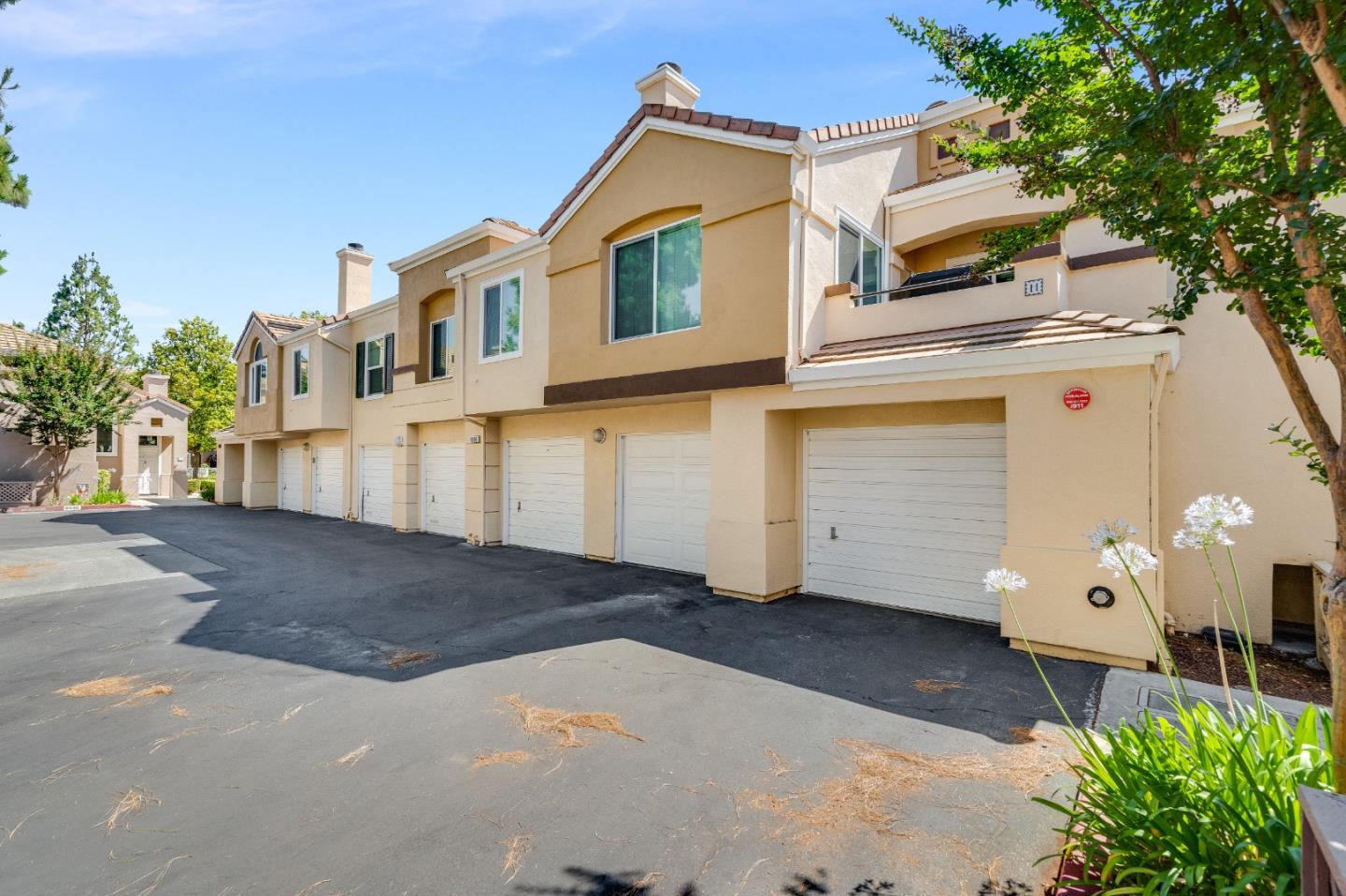 6936 Gregorich Drive, Unit E San Jose, CA 95138 - Photo 32 of 44 a view of a house with a yard
