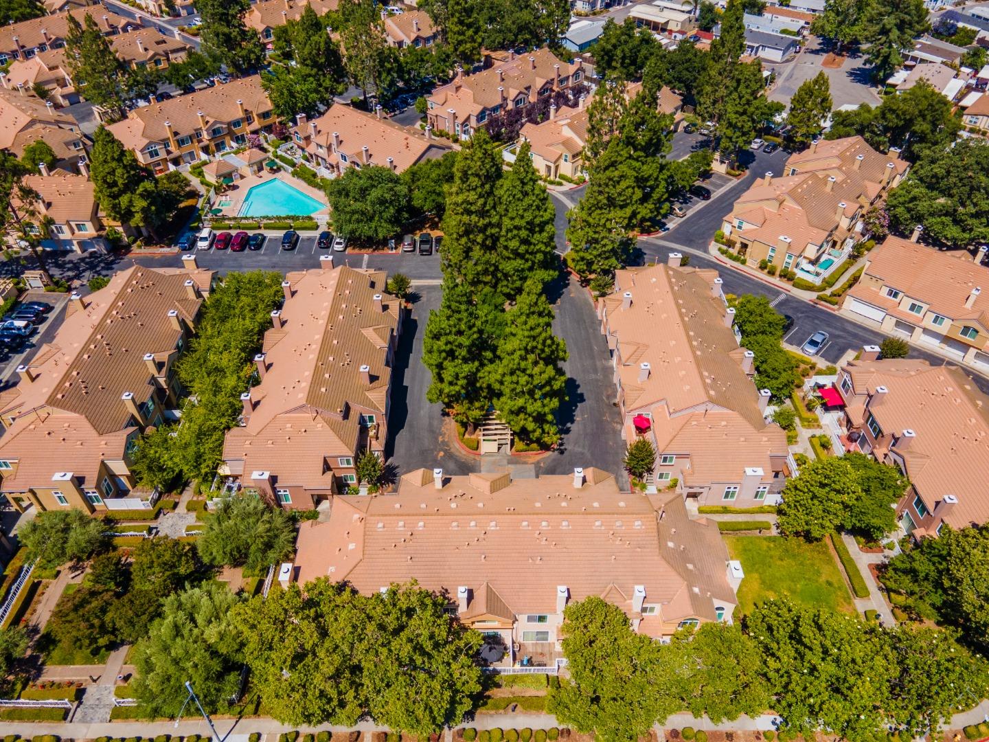 6936 Gregorich Drive, Unit E San Jose, CA 95138 - Photo 40 of 44 an aerial view of residential houses with outdoor space