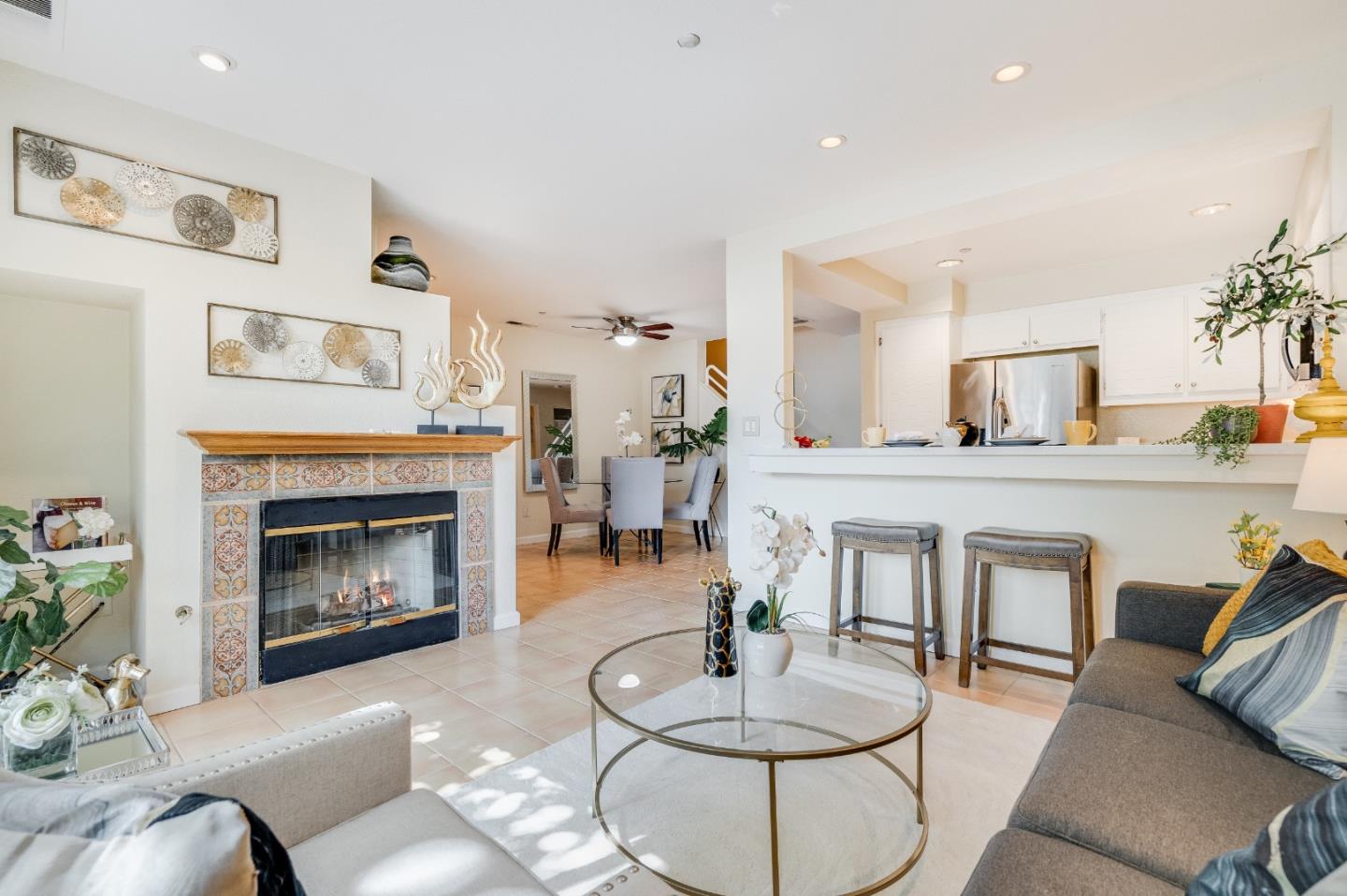 6936 Gregorich Drive, Unit E San Jose, CA 95138 - Photo 4 of 44 a living room with furniture and a fireplace