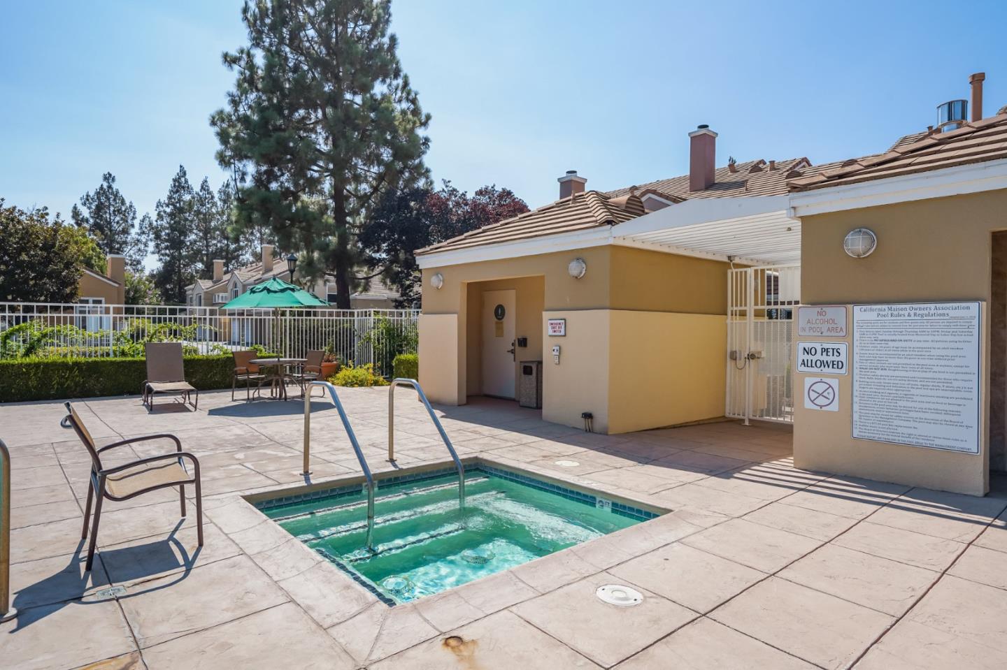 6936 Gregorich Drive, Unit E San Jose, CA 95138 - Photo 44 of 44 a view of a patio with a table and chairs next to a yard