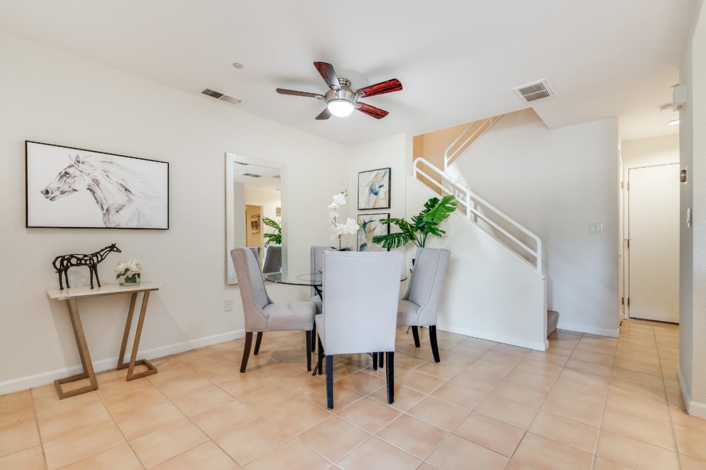 6936 Gregorich Drive, Unit E San Jose, CA 95138 - Photo 6 of 44 a view of a dining room with furniture
