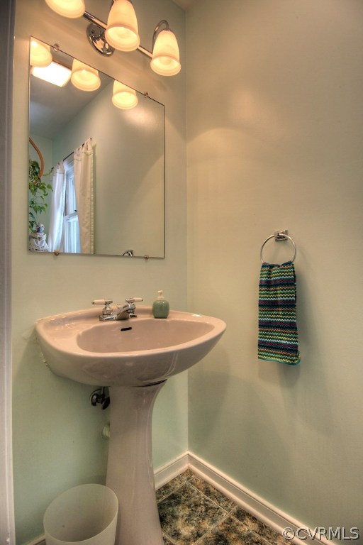 17516 Old Ridge Road Montpelier, VA 23192 - Photo 14 of 27 a bathroom with a sink a mirror and vanity